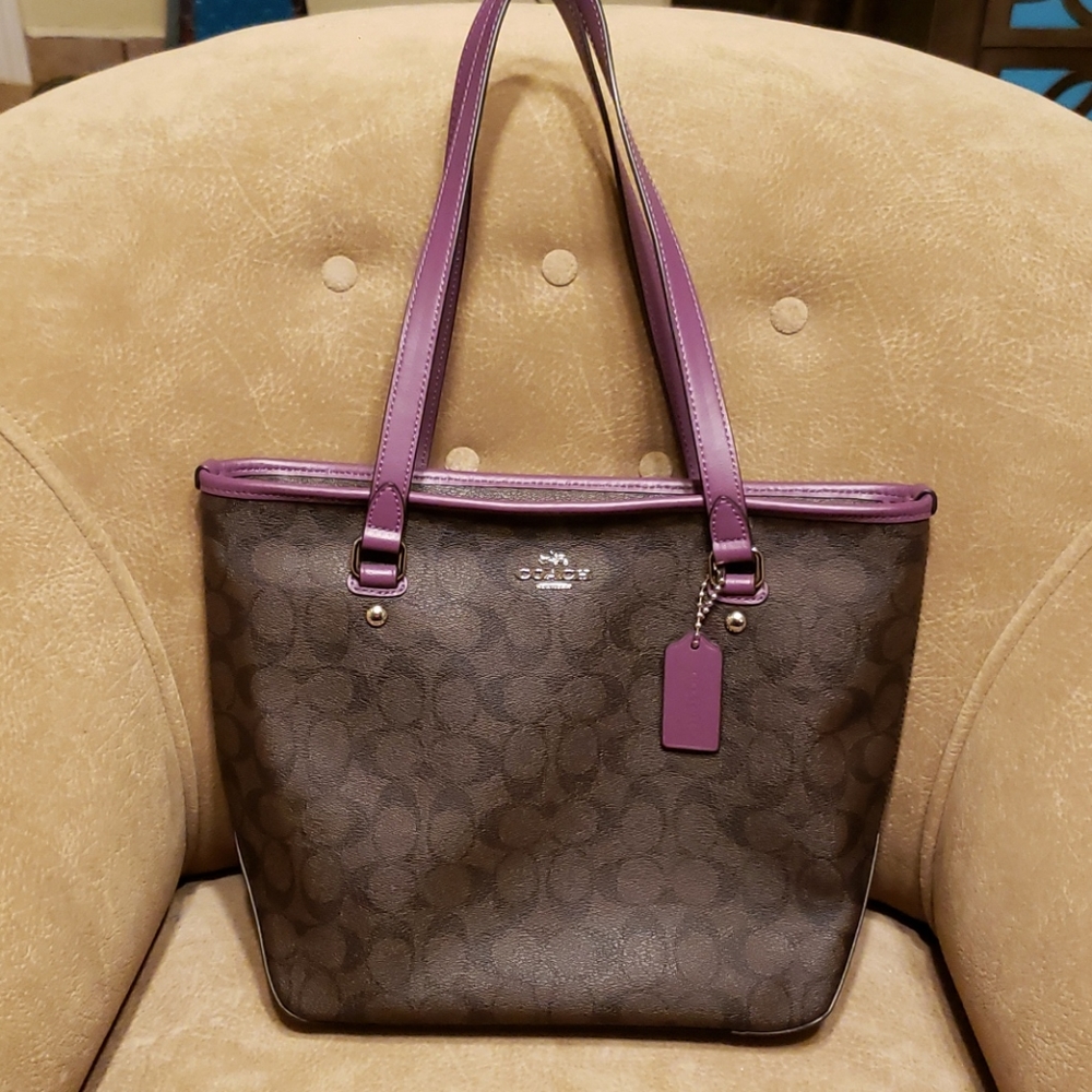 Coach leather shoulder bag in brown and purple.